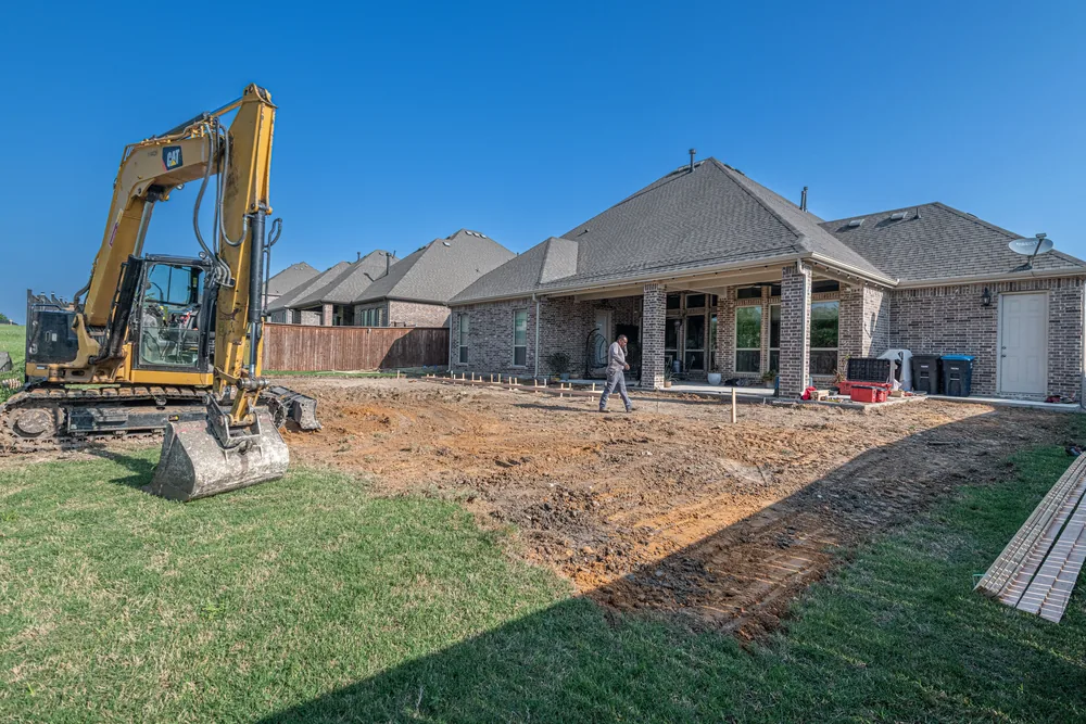 A bare graded lot before construction