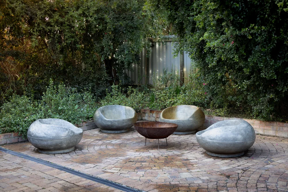A stone terrace with a fire pit